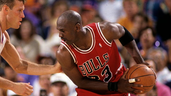 Suns guard Dan Majerle defends Bulls guard Michael Jordan during Game 1 of the NBA Finals in 1993 in Phoenix.