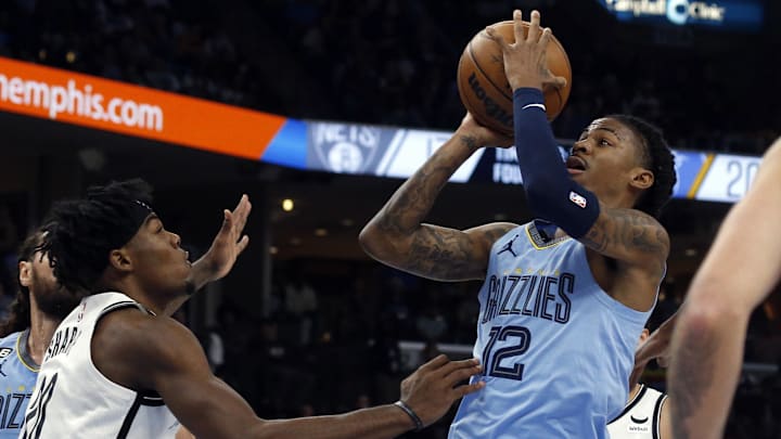 Oct 24, 2022; Memphis, Tennessee, USA; Memphis Grizzlies guard Ja Morant (12) shoots during the first half against the Brooklyn Nets at FedExForum. Mandatory Credit: Petre Thomas-USA TODAY Sports Oct 24, 2022; Memphis, Tennessee, USA; Memphis Grizzlies guard Ja Morant (12) shoots during the first half against the Brooklyn Nets at FedExForum. Mandatory Credit: Petre Thomas-USA TODAY Sports