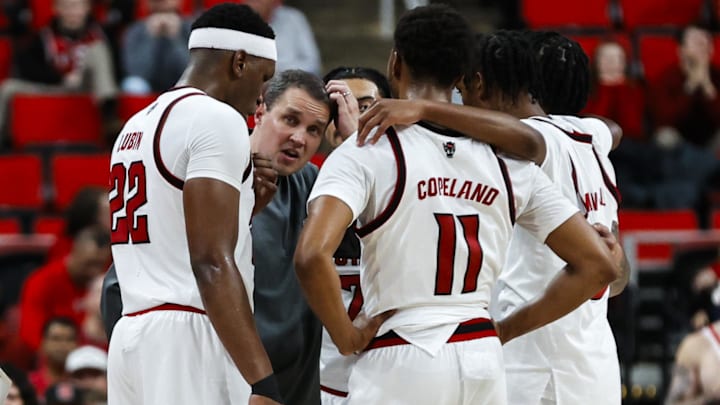 Dec 6, 2025; Raleigh, North Carolina, USA; NC State Wolfpack huddle with head coach Will Wade during the second half of the game against UNC Asheville Bulldogs at Lenovo Center. Mandatory Credit: Jaylynn Nash-Imagn Images