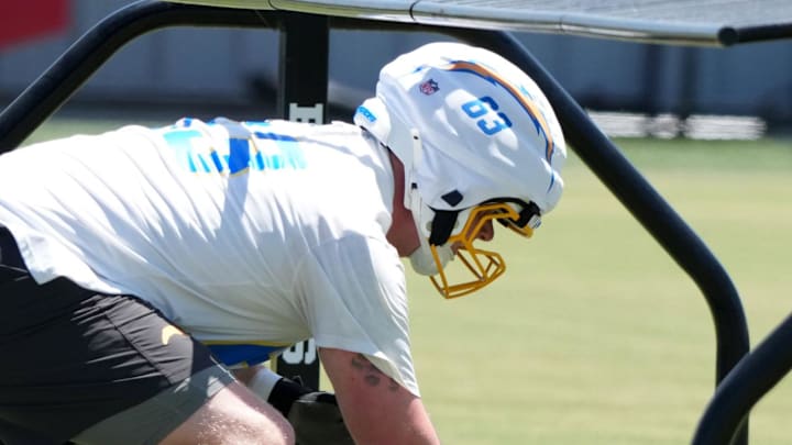 Jun 16, 2025; El Segundo, CA, USA; Los Angeles Chargers center Josh Kaltenberger (63) snaps the ball during organized team activities at The Bolt. Mandatory Credit: Kirby Lee-Imagn Images