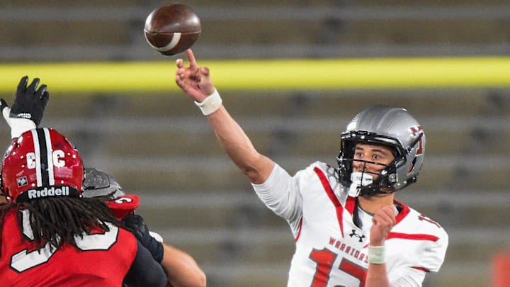 Thompson's quarterback Trent Seaborn (12) passes against Opelika during their AHSAA 7A Football State Championship game in Birmingham, Ala. on Wednesday December 3, 2025.