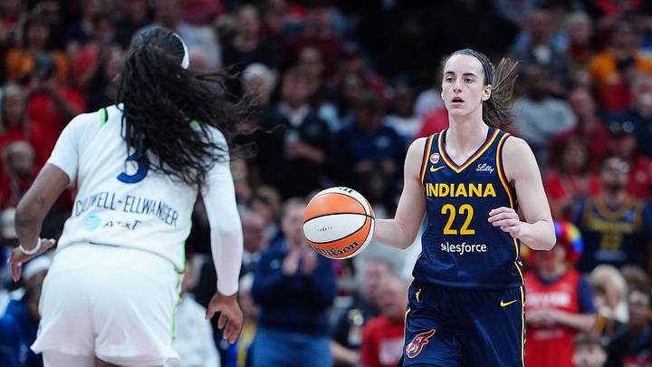 Indiana Fever guard Caitlin Clark dribbling down the court against the Minnesota Lynx. Indiana Fever guard Caitlin Clark dribbling down the court against the Minnesota Lynx.