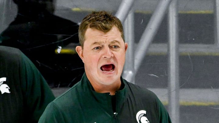 Michigan State's head coach Adam Nightingale, right, calls out to players as assistant coach Mike Towns looks on during hockey practice on Thursday, Sept. 25, 2025, at Munn Arena in East Lansing.