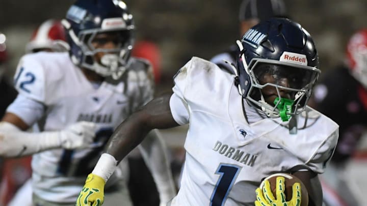 Dorman Cavaliers running back Nick Means (1) rushes the ball Friday, Aug. 22, 2025 during the SCHSL football game against the Greenville Red Raiders at Greenville High School in Greenville, South Carolina.