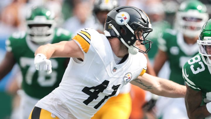 Sep 7, 2025; East Rutherford, New Jersey, USA; New York Jets wide receiver Josh Reynolds (83) fights for yards against Pittsburgh Steelers linebacker Payton Wilson (41) during the fourth quarter at MetLife Stadium. Mandatory Credit: Vincent Carchietta-Imagn Images