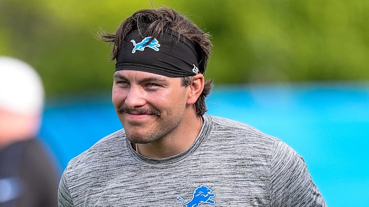 Detroit Lions linebacker Malcolm Rodriguez (44) watches practice during training camp 