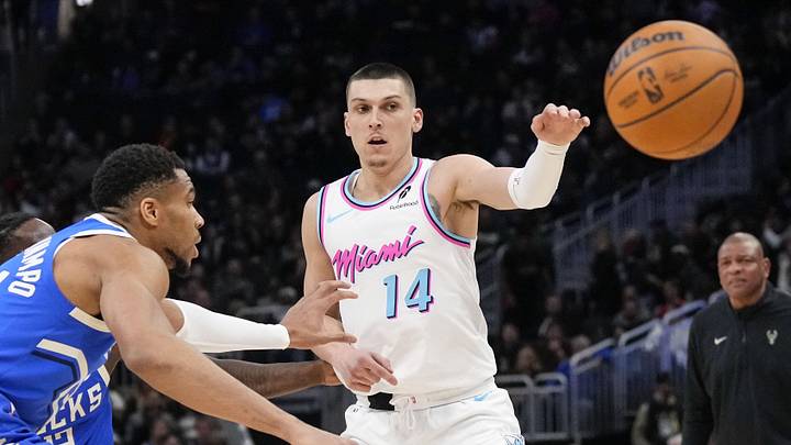 Feb 23, 2025; Milwaukee, Wisconsin, USA; Miami Heat guard Tyler Herro (14) passes the ball away from Milwaukee Bucks forward Giannis Antetokounmpo (34) during the third quarter at Fiserv Forum. Mandatory Credit: Jeff Hanisch-Imagn Images Feb 23, 2025; Milwaukee, Wisconsin, USA; Miami Heat guard Tyler Herro (14) passes the ball away from Milwaukee Bucks forward Giannis Antetokounmpo (34) during the third quarter at Fiserv Forum. Mandatory Credit: Jeff Hanisch-Imagn Images