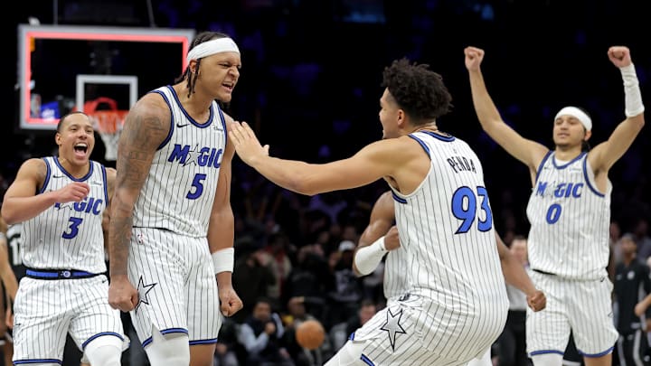 Jan 7, 2026; Brooklyn, New York, USA; Orlando Magic forward Paolo Banchero (5) celebrates with teammates after his overtime game-winning three point shot against the Brooklyn Nets at Barclays Center. Mandatory Credit: Brad Penner-Imagn Images