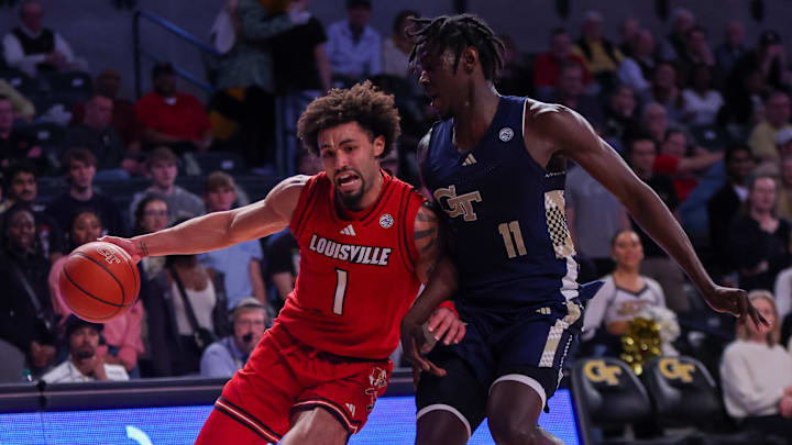 Feb 1, 2025; Atlanta, Georgia, USA; Louisville Cardinals guard J'Vonne Hadley (1) is defended by Georgia Tech Yellow Jackets forward Baye Ndongo (11) in the first half at McCamish Pavilion. Mandatory Credit: Brett Davis-Imagn Images Feb 1, 2025; Atlanta, Georgia, USA; Louisville Cardinals guard J'Vonne Hadley (1) is defended by Georgia Tech Yellow Jackets forward Baye Ndongo (11) in the first half at McCamish Pavilion. Mandatory Credit: Brett Davis-Imagn Images