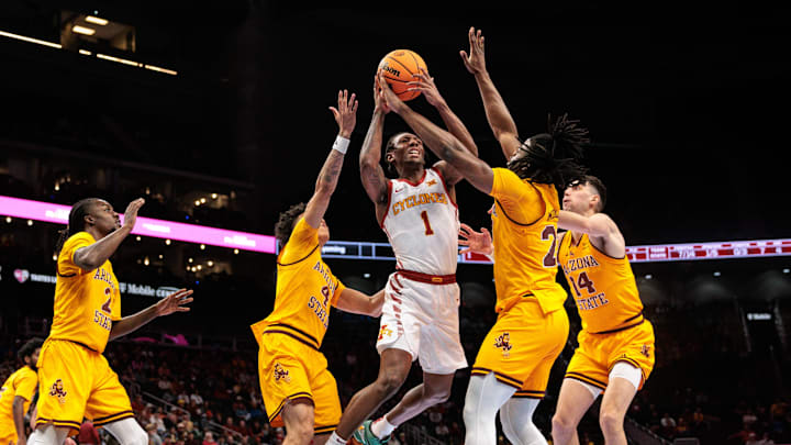 Mar 11, 2026; Kansas City, MO, USA; Iowa State Cyclones guard Jamarion Batemon (1) shoots the ball between Arizona State Sun Devils guard Bryce Ford (4) and Arizona State Sun Devils guard Anthony Johnson (2) during the first half at T-Mobile Center. 