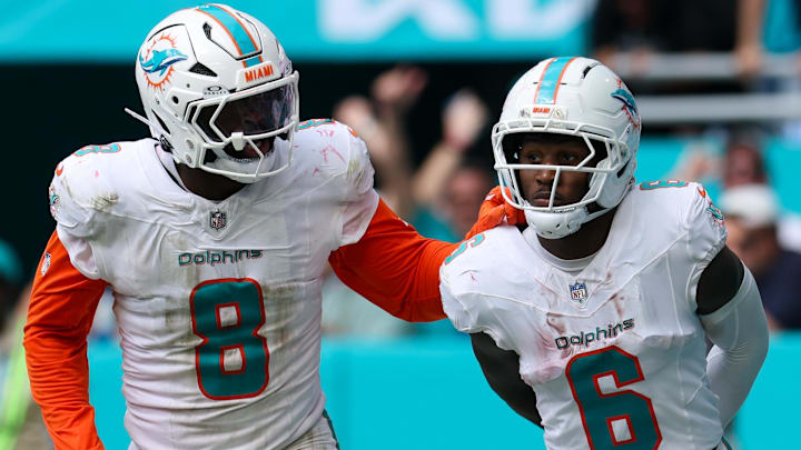 Sep 14, 2025; Miami Gardens, Florida, USA; Miami Dolphins wide receiver Malik Washington (6) reacts after scoring a touchdown against the New England Patriots in the fourth quarter at Hard Rock Stadium. Mandatory Credit: Nathan Ray Seebeck-Imagn Images
