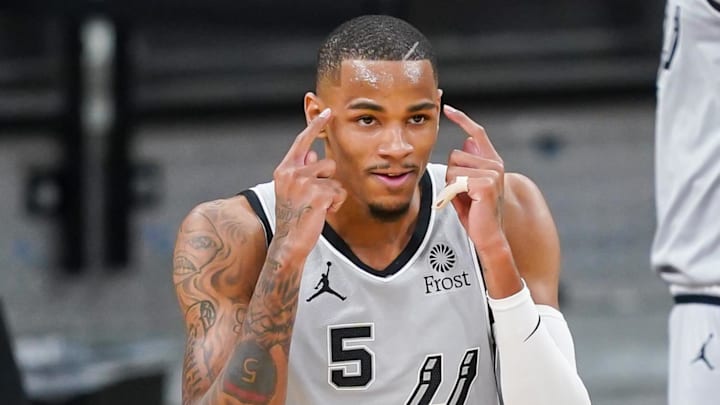 Mar 29, 2021; San Antonio, Texas, USA; San Antonio Spurs guard Dejounte Murray (5) reacts in the first half against the Sacramento Kings at the AT&T Center. Mandatory Credit: Daniel Dunn-Imagn Images