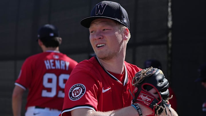 Feb 15, 2025; West Palm Beach, FL, USA; Washington Nationals pitcher DJ Herz (77) throws in the bullpen during Spring Training