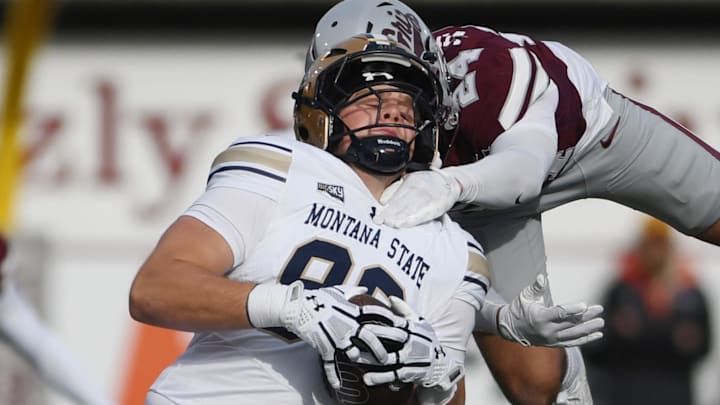 Nov 22, 2025; Missoula, MT, USA; (Editors Notes: Caption Correction) Montana State Bobcats tight end Hunter Provience (86) is tackled after his reception by Montana Grizzlies safety Diezel Wilkinson (24) during the first half at Washington-Grizzly Stadium. Mandatory Credit: Michael Thomas Shroyer-Imagn Images Nov 22, 2025; Missoula, MT, USA; (Editors Notes: Caption Correction) Montana State Bobcats tight end Hunter Provience (86) is tackled after his reception by Montana Grizzlies safety Diezel Wilkinson (24) during the first half at Washington-Grizzly Stadium. Mandatory Credit: Michael Thomas Shroyer-Imagn Images