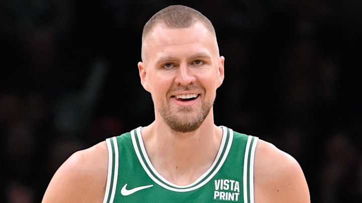 Apr 5, 2024; Boston, Massachusetts, USA; Boston Celtics center Kristaps Porzingis (8) reacts to game action against the Sacramento Kings during the first half at TD Garden. Mandatory Credit: Eric Canha-Imagn Images