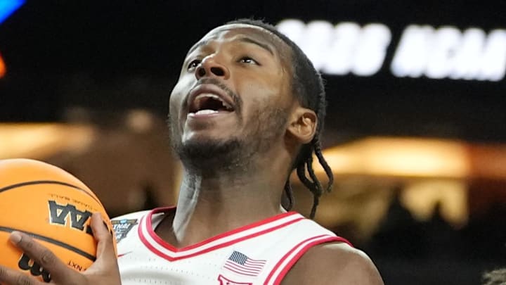 Apr 4, 2026; Indianapolis, IN, USA; Arizona Wildcats guard Jaden Bradley (0) shoots against Michigan Wolverines forward Morez Johnson Jr. (21) in the second half during a semifinal of the Final Four of the men's 2026 NCAA Tournament at Lucas Oil Stadium. Mandatory Credit: Robert Deutsch-Imagn Images Apr 4, 2026; Indianapolis, IN, USA; Arizona Wildcats guard Jaden Bradley (0) shoots against Michigan Wolverines forward Morez Johnson Jr. (21) in the second half during a semifinal of the Final Four of the men's 2026 NCAA Tournament at Lucas Oil Stadium. Mandatory Credit: Robert Deutsch-Imagn Images