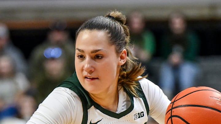 Michigan State's Sara Sambolic, right, moves the ball as Ohio State's Kennedy Cambridge defends during the first quarter on Sunday, March 1, 2026, at the Breslin Center in East Lansing. Michigan State's Sara Sambolic, right, moves the ball as Ohio State's Kennedy Cambridge defends during the first quarter on Sunday, March 1, 2026, at the Breslin Center in East Lansing.