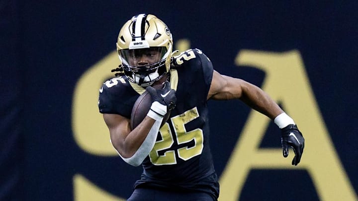 Jan 7, 2024; New Orleans, Louisiana, USA;  New Orleans Saints running back Kendre Miller (25) runs against the Atlanta Falcons during the first half at Caesars Superdome. Mandatory Credit: Stephen Lew-Imagn Images