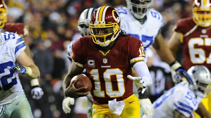 Dec 30, 2012; Landover, MD, USA; Washington Redskins quarterback Robert Griffin III (10) runs for a first down against the Dallas Cowboys during the second half at FedEX Field. The Redskins won 28 - 18. Mandatory Credit: Brad Mills-USA Today Sports Dec 30, 2012; Landover, MD, USA; Washington Redskins quarterback Robert Griffin III (10) runs for a first down against the Dallas Cowboys during the second half at FedEX Field. The Redskins won 28 - 18. Mandatory Credit: Brad Mills-USA Today Sports