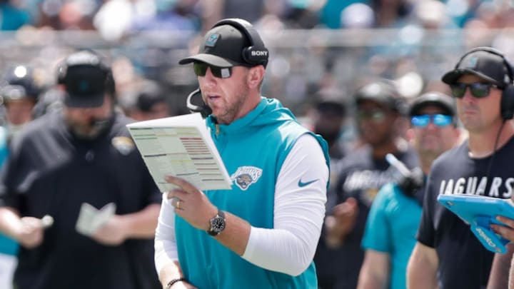 Sep 21, 2025; Jacksonville, Florida, USA; Jacksonville Jaguars head coach Liam Coen reads a play during the second quarter against the Houston Texans at EverBank Stadium. Mandatory Credit: Travis Register-Imagn Images