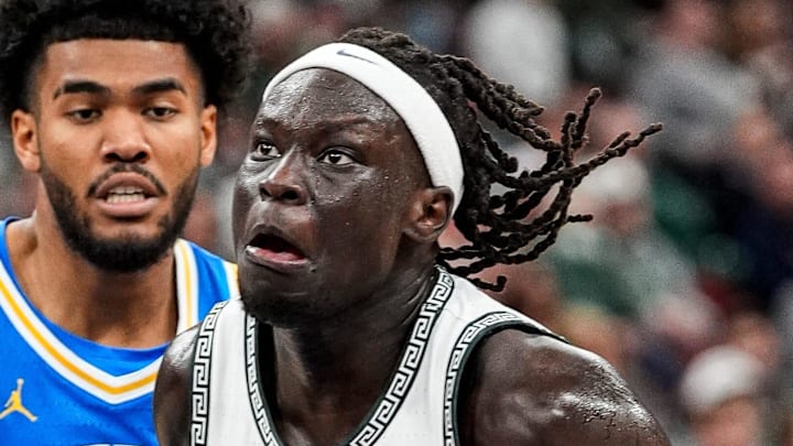 Michigan State guard Kur Teng (2) dribbles against UCLA guard Donovan Dent (2) during the first half of Big Ten tournament quarterfinal at United Center in Chicago on Friday, March 13, 2026.