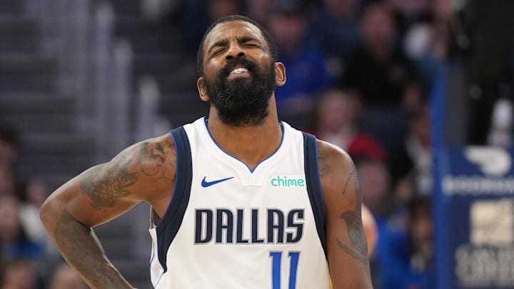 Dec 15, 2024; San Francisco, California, USA; Dallas Mavericks guard Kyrie Irving (11) reacts after suffering an injury during the fourth quarter against the Golden State Warriors at Chase Center. Mandatory Credit: Darren Yamashita-Imagn Images