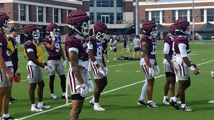 Mississippi State offensive players wait their turn during a drill at Thursday's first preseason practice.