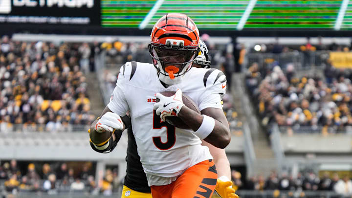 Bengals Tee Higgins (5) takes the ball down the field during their game against the Steelers on Sunday November 16, 2025 at Acrisure Stadium.