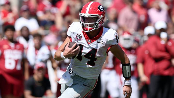 Georgia Football QB Gunner Stockton runs against Arkansas. Georgia Football QB Gunner Stockton runs against Arkansas.