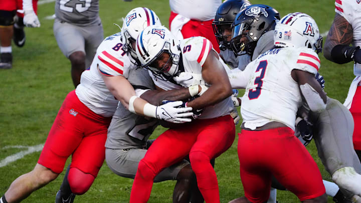 Nov 11, 2023; Boulder, Colorado, USA; Arizona Wildcats wide receiver Montana Lemonious-Craig (5) carries the ball in the fourth quarter against the Colorado Buffaloes at Folsom Field. Mandatory Credit: Ron Chenoy-Imagn Images