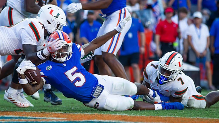 Florida Gators running back Treyaun Webb (5) drives for a touchdown to make it 38-16 during the season opener at Ben Hill Griffin Stadium in Gainesville, FL on Saturday, August 31, 2024 against the University of Miami Hurricanes in the second half. Miami defeated the Gators 41-17. [Doug Engle/Gainesville Sun]