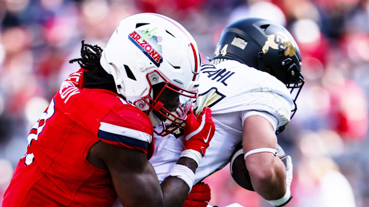 Oct 19, 2024; Tucson, Arizona, USA; Arizona Wildcats defensive lineman Chase Kennedy (11) tackles Colorado Buffaloes during the fourth quarter at Arizona Stadium. Mandatory Credit: Aryanna Frank-Imagn Images