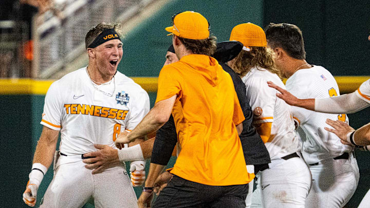 Jun 14, 2024; Omaha, NE, USA; The Tennessee Volunteers celebrate after a walk off single by left fielder Dylan Dreiling (8) against the Florida State Seminoles at Charles Schwab Filed Omaha. Mandatory Credit: Dylan Widger-USA TODAY Sports