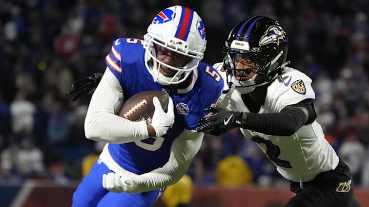 Buffalo Bills wide receiver Joshua Palmer (5) runs the ball against Baltimore Ravens cornerback Nate Wiggins (2) during the fourth quarter at Highmark Stadium.