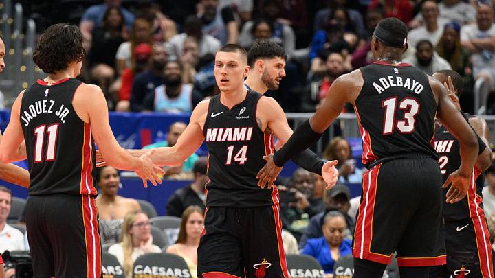 Mar 31, 2025; Washington, District of Columbia, USA; Miami Heat guard Tyler Herro (14) reacts with center Bam Adebayo (13), and guard Jaime Jaquez Jr. (11) during the third quarter against the Washington Wizards at Capital One Arena. Mandatory Credit: Reggie Hildred-Imagn Images Mar 31, 2025; Washington, District of Columbia, USA; Miami Heat guard Tyler Herro (14) reacts with center Bam Adebayo (13), and guard Jaime Jaquez Jr. (11) during the third quarter against the Washington Wizards at Capital One Arena. Mandatory Credit: Reggie Hildred-Imagn Images