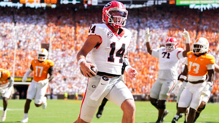Georgia quarterback Gunner Stockton (14) runs into the end zone for a touchdown during a college football game between Tennessee and Georgia at Neyland Stadium in Knoxville, Tenn., on Sept. 13, 2025.