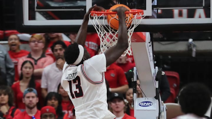 Texas Tech Red Raiders forward Marial Akuentok (13) dunks the ball. Texas Tech Red Raiders forward Marial Akuentok (13) dunks the ball.
