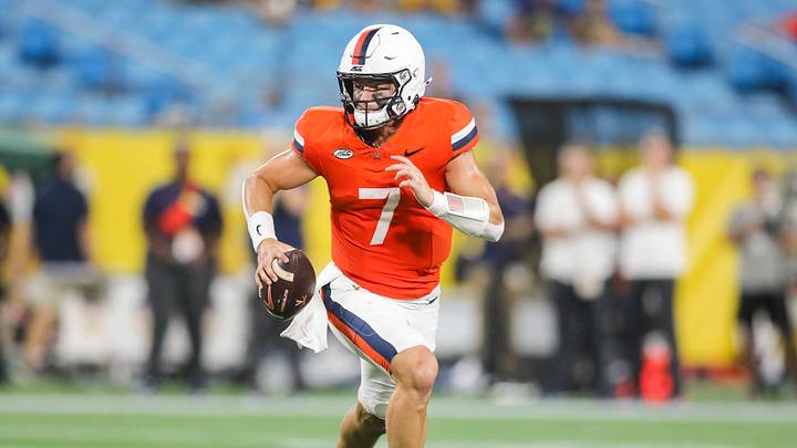 Sep 19, 2026; Charlotte, North Carolina, USA; Virginia Cavaliers quarterback Beau Pribula (7) rolls out to pass during the third quarter against the West Virginia Mountaineers at Bank of America Stadium. Mandatory Credit: Ben Queen-Imagn Images Sep 19, 2026; Charlotte, North Carolina, USA; Virginia Cavaliers quarterback Beau Pribula (7) rolls out to pass during the third quarter against the West Virginia Mountaineers at Bank of America Stadium. Mandatory Credit: Ben Queen-Imagn Images