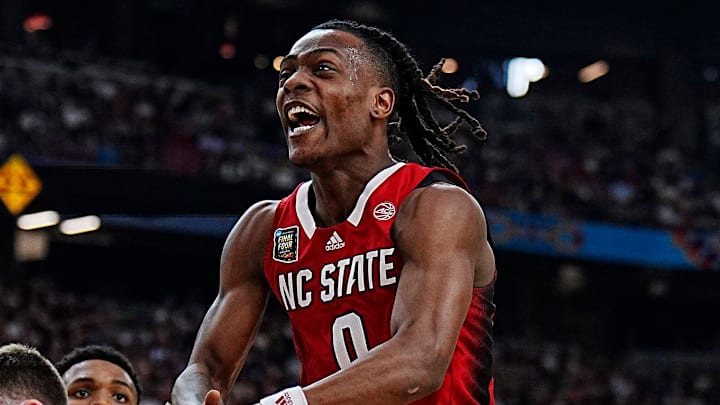 North Carolina State guard DJ Horne (0) has the ball stripped by Purdue guard Fletcher Loyer (2) during the Final Four semifinal game at State Farm Stadium on April 6, 2024. North Carolina State guard DJ Horne (0) has the ball stripped by Purdue guard Fletcher Loyer (2) during the Final Four semifinal game at State Farm Stadium on April 6, 2024.
