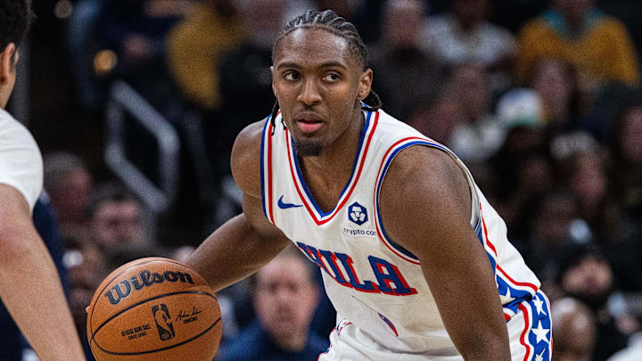 Jan 18, 2025; Indianapolis, Indiana, USA; Philadelphia 76ers guard Tyrese Maxey (0) dribbles the ball while  Indiana Pacers guard Ben Sheppard (26) defends in the second half at Gainbridge Fieldhouse. Mandatory Credit: Trevor Ruszkowski-Imagn Images