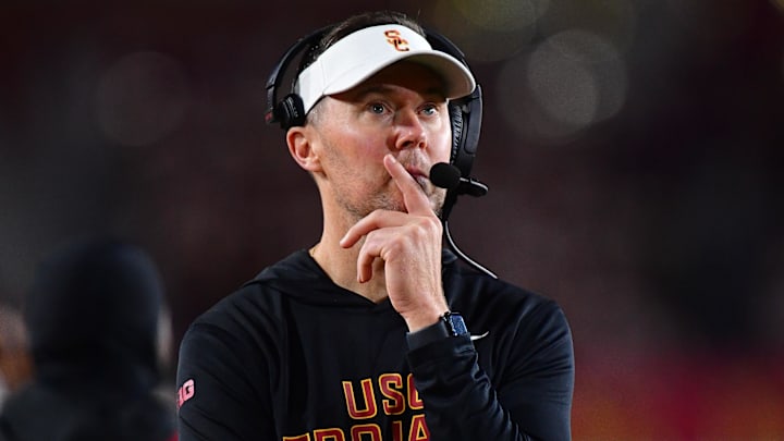 Nov 7, 2025; Los Angeles, California, USA; Southern California Trojans head coach Lincoln Riley watches game action against the Northwestern Wildcats during the second half at the Los Angeles Memorial Coliseum. Mandatory Credit: Gary A. Vasquez-Imagn Images Nov 7, 2025; Los Angeles, California, USA; Southern California Trojans head coach Lincoln Riley watches game action against the Northwestern Wildcats during the second half at the Los Angeles Memorial Coliseum. Mandatory Credit: Gary A. Vasquez-Imagn Images