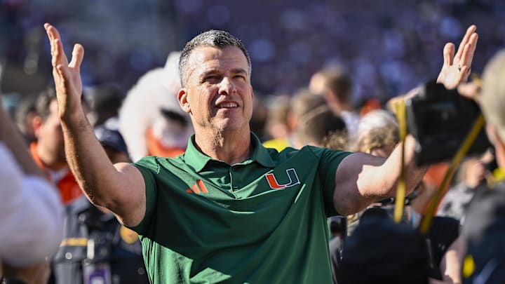 Dec 20, 2025; College Station, TX, USA; Miami Hurricanes head coach Mario Cristobal celebrates as he walks off the field after the Hurricanes win over the Texas A&M Aggies at Kyle Field. Mandatory Credit: Jerome Miron-Imagn Images Dec 20, 2025; College Station, TX, USA; Miami Hurricanes head coach Mario Cristobal celebrates as he walks off the field after the Hurricanes win over the Texas A&M Aggies at Kyle Field. Mandatory Credit: Jerome Miron-Imagn Images