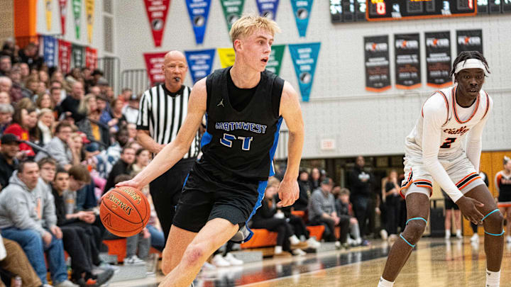 Waukee Northwest's Colin Rice takes the ball down the court against Valley High School.