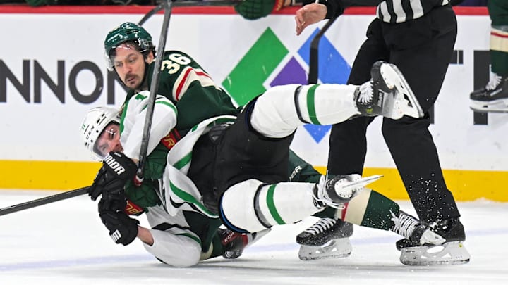 Mar 21, 2026; Saint Paul, Minnesota, USA; Minnesota Wild forward Mats Zuccarello (36) wrestles Dallas Stars forward Nathan Bastian (11) to the ice during the first period at Grand Casino Arena. Mandatory Credit: Nick Wosika-Imagn Images