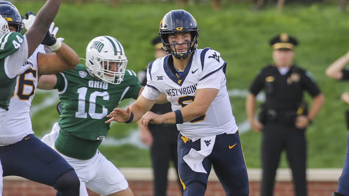 Sep 6, 2025; Athens, Ohio, USA; West Virginia Mountaineers quarterback Nicco Marchiol (8) throws a pass during the fourth quarter against the Ohio Bobcats at Peden Stadium. Mandatory Credit: Ben Queen-Imagn Images