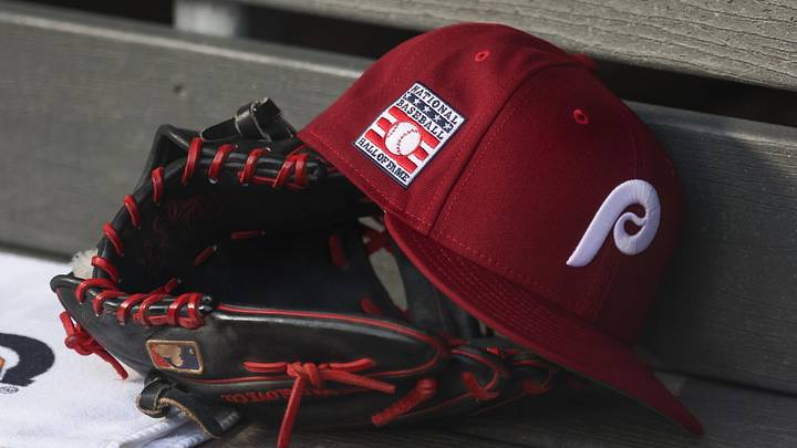 Jul 25, 2025; Bronx, New York, USA; A detailed view of a Hall of Fame patch on a Philadelphia Phillies hat resting in the dugout during the second inning against the New York Yankees at Yankee Stadium. 