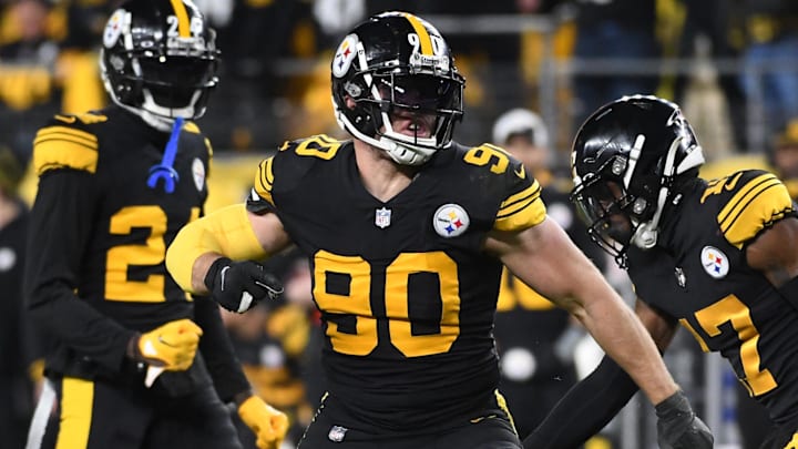 Dec 7, 2023; Pittsburgh, Pennsylvania, USA;  Pittsburgh Steelers linebacker T.J. Watt (90) celebrates a tackle of New England Patriots running back Ezekiel Elliott (15) during the fourth quarter at Acrisure Stadium. The Patriots won 21-18. Mandatory Credit: Philip G. Pavely-Imagn Images