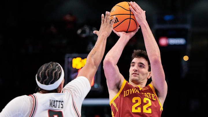 Mar 12, 2026; Kansas City, MO, USA; Iowa State Cyclones forward Milan Momcilovic (22) shoots the ball over Texas Tech Red Raiders forward LeJuan Watts (3) during the second half at T-Mobile Center. Mar 12, 2026; Kansas City, MO, USA; Iowa State Cyclones forward Milan Momcilovic (22) shoots the ball over Texas Tech Red Raiders forward LeJuan Watts (3) during the second half at T-Mobile Center.