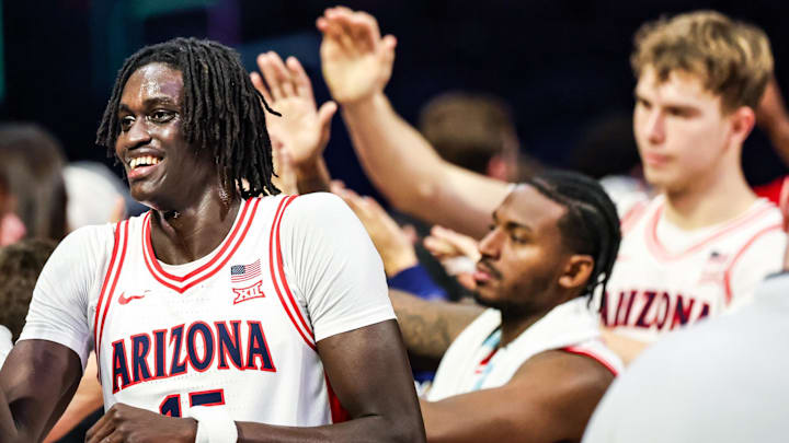 Dec 16, 2025; Tucson, Arizona, USA; Arizona Wildcats forward Ivan Kharchenkov (8) high fives fans after they secure the win against the Abilene Christian Wildcats at the end of the game at McKale Memorial Center. Mandatory Credit: Aryanna Frank-Imagn Images