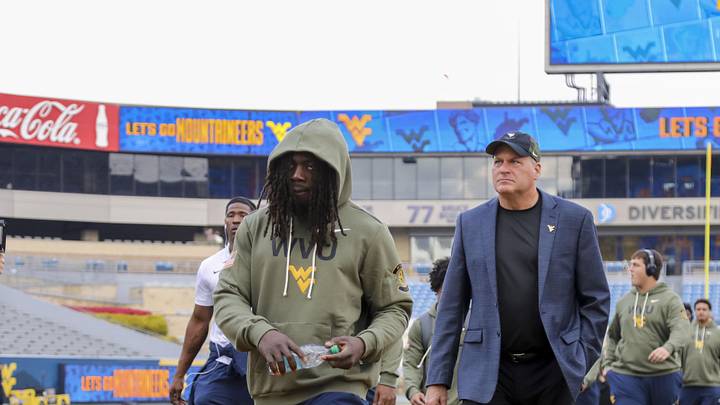 Nov 8, 2025; Morgantown, West Virginia, USA; West Virginia Mountaineers head coach Rich Rodriguez walks with his team as they arrive before their game against the Colorado Buffaloes at Milan Puskar Stadium. Mandatory Credit: Ben Queen-Imagn Images Nov 8, 2025; Morgantown, West Virginia, USA; West Virginia Mountaineers head coach Rich Rodriguez walks with his team as they arrive before their game against the Colorado Buffaloes at Milan Puskar Stadium. Mandatory Credit: Ben Queen-Imagn Images